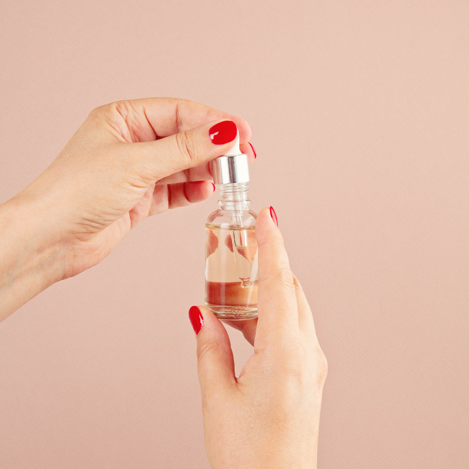 woman-hands-holding-skin-care-product-WEUYYQH.jpg